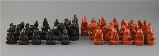 An 18th century red and black lacquer Burmese figural chess set, kings 3in.